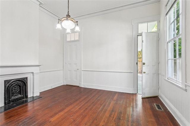 101012 Philip St, New Orleans, LA 70130 - unfurnished dining area with hardwood / wood-style flooring, ornamental molding, a fireplace, and baseboards