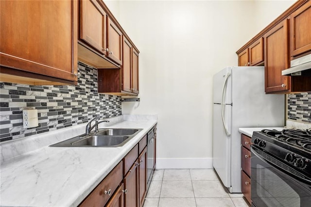 101012 Philip St, New Orleans, LA 70130 - kitchen with gas stove, a sink, light countertops, baseboards, and backsplash