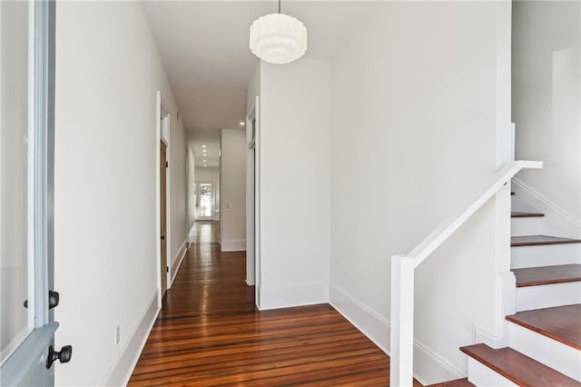 2623 Dauphine St, New Orleans, LA 70117 - hallway with wood finished floors and stairway