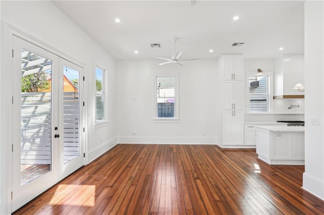 2623 Dauphine St, New Orleans, LA 70117 - interior space with visible vents, baseboards, a ceiling fan, and dark wood-style floors