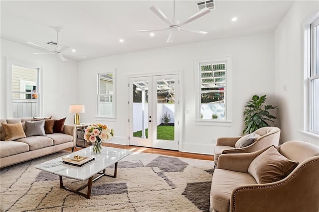 2623 Dauphine St, New Orleans, LA 70117 - living area with a ceiling fan, wood finished floors, recessed lighting, and french doors