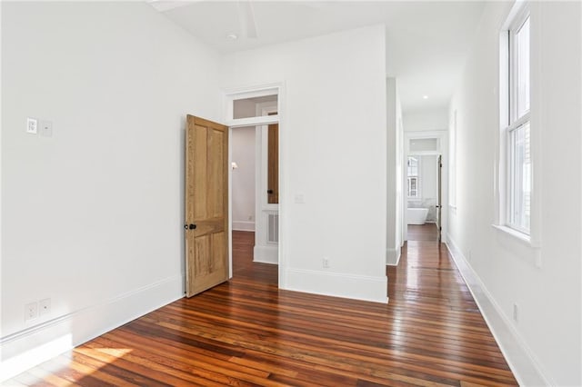 2623 Dauphine St, New Orleans, LA 70117 - unfurnished bedroom featuring dark wood-style floors and baseboards