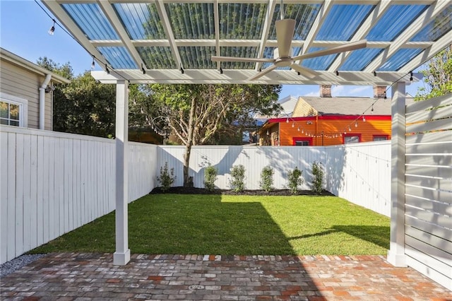 2623 Dauphine St, New Orleans, LA 70117 - view of yard with a fenced backyard, a patio, and a pergola