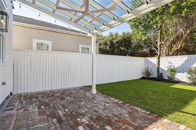 2623 Dauphine St, New Orleans, LA 70117 - fenced backyard featuring a pergola and a patio area