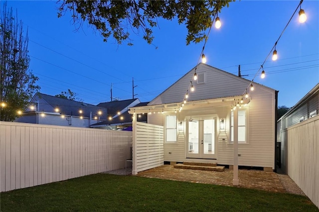 2623 Dauphine St, New Orleans, LA 70117 - back of property featuring a fenced backyard and french doors