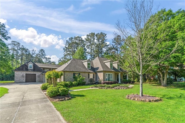 view of front of house with concrete driveway, a garage, and a front lawn