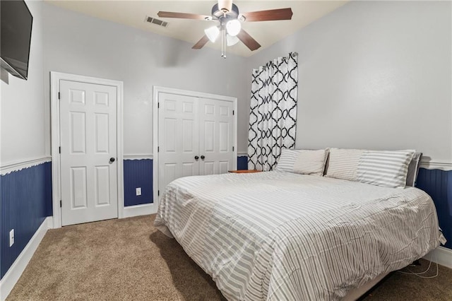 bedroom featuring visible vents, ceiling fan, and carpet floors