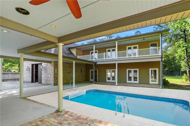 pool featuring french doors and a patio area
