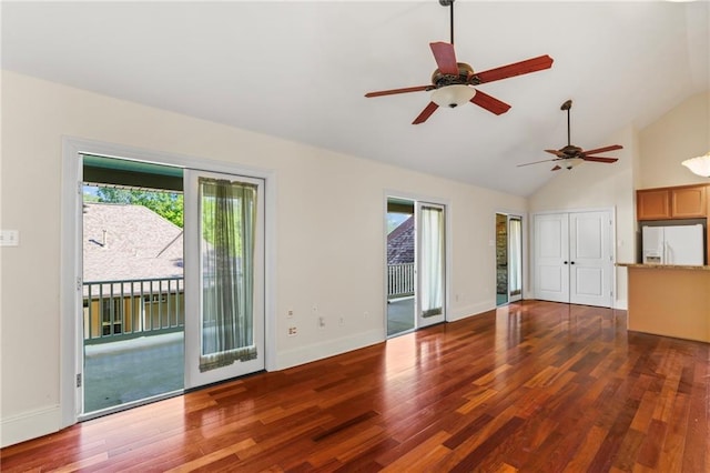 unfurnished living room featuring wood finished floors, high vaulted ceiling, baseboards, and a ceiling fan