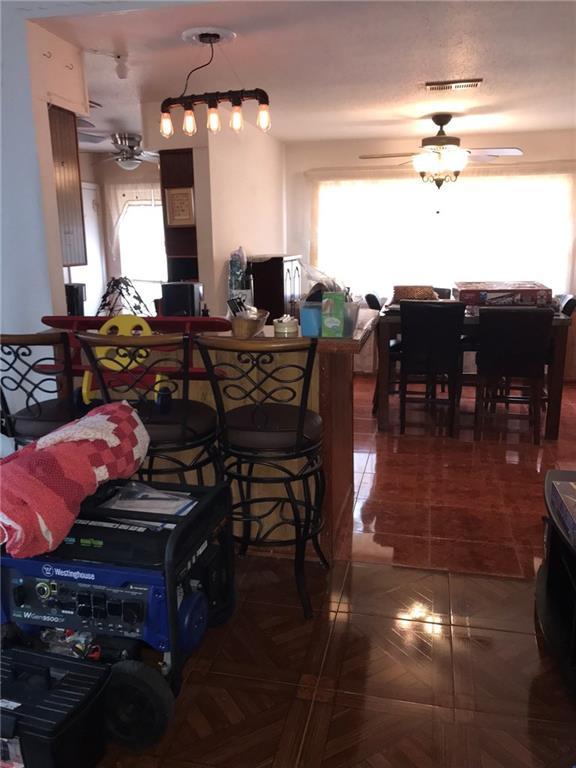 219 Queen Anne Dr, Slidell, LA 70460 - dining room with tile patterned flooring, visible vents, and a ceiling fan