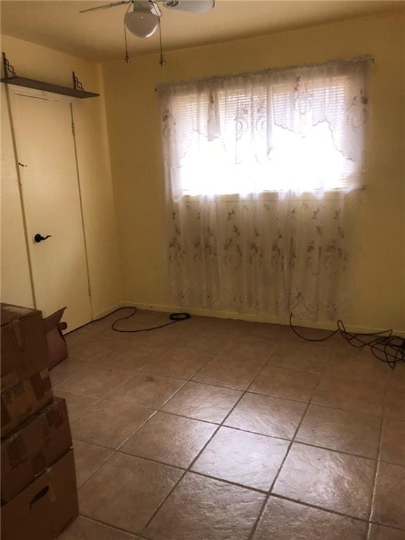 219 Queen Anne Dr, Slidell, LA 70460 - empty room with light tile patterned floors and ceiling fan