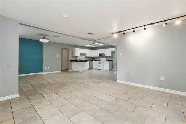3408 Lake Villa Dr, Metairie, LA 70002 - kitchen featuring stainless steel dishwasher, white cabinetry, a peninsula, and open floor plan