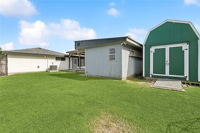 3408 Lake Villa Dr, Metairie, LA 70002 - rear view of property featuring a shed and a lawn