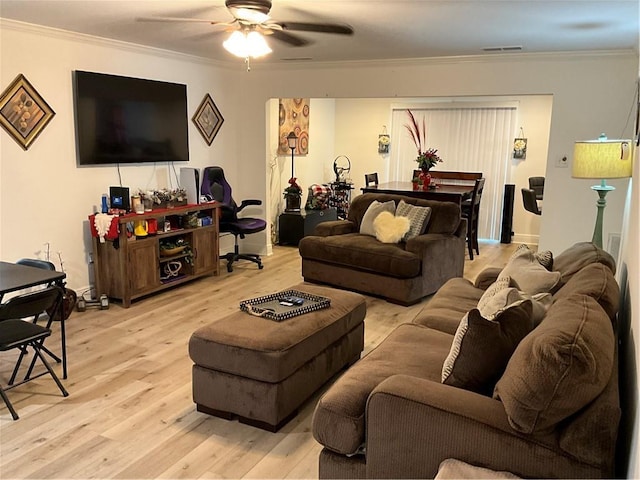 420 Michigan Ave, Slidell, LA 70458 - living area featuring crown molding, ceiling fan, and light wood-type flooring
