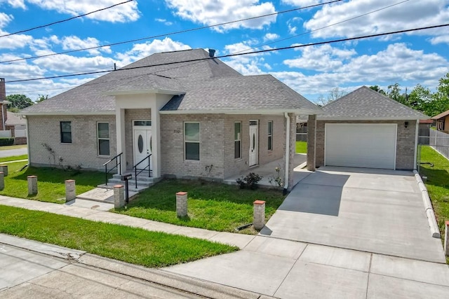 view of front of home with a garage, a front yard, brick siding, and a shingled roof