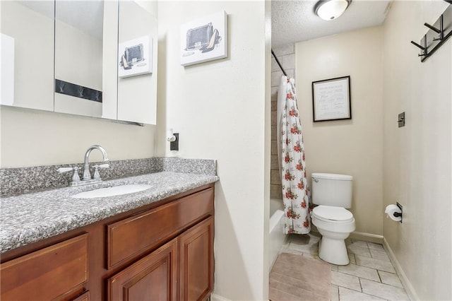 bathroom with vanity, baseboards, shower / bath combo, tile patterned flooring, and toilet