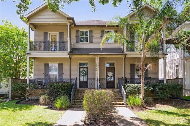 view of front of property featuring a porch and stairs
