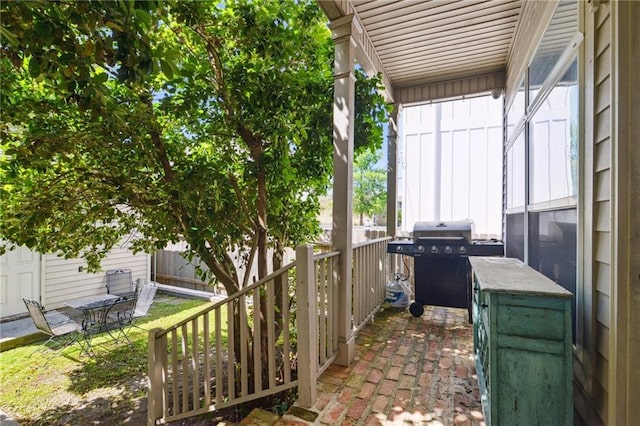 view of patio featuring grilling area and fence
