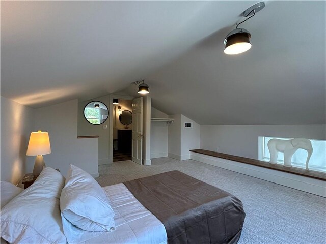 7713 Zimpel St, New Orleans, LA 70118 - bathroom with vanity, baseboards, lofted ceiling, and tile patterned flooring