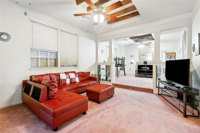 3856 Gentilly Dr, New Orleans, LA 70122 - carpeted living room featuring ceiling fan, decorative columns, and plenty of natural light