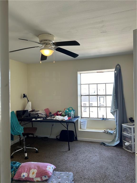 carpeted bedroom with a ceiling fan