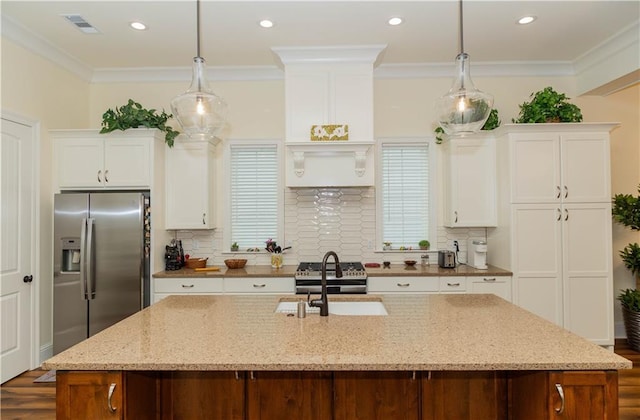 kitchen featuring visible vents, white cabinets, stainless steel refrigerator with ice dispenser, a sink, and dark wood-style floors