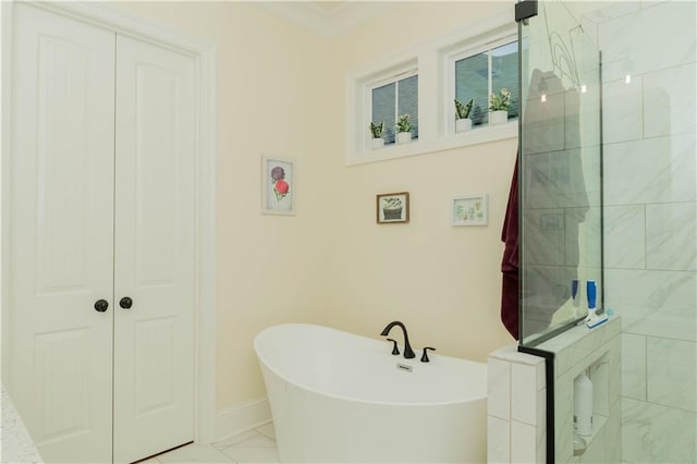 full bathroom with a freestanding bath, baseboards, marble finish floor, and walk in shower