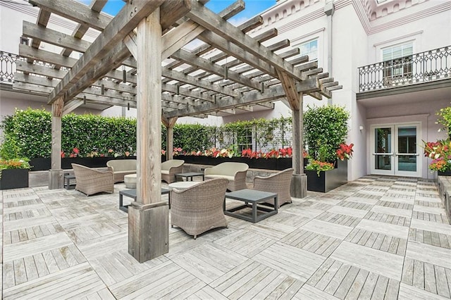 view of patio / terrace featuring outdoor lounge area, french doors, and a pergola