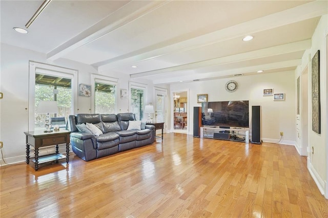 3528 Tolmas Dr, Metairie, LA 70002 - living area featuring baseboards, beam ceiling, and light wood-type flooring