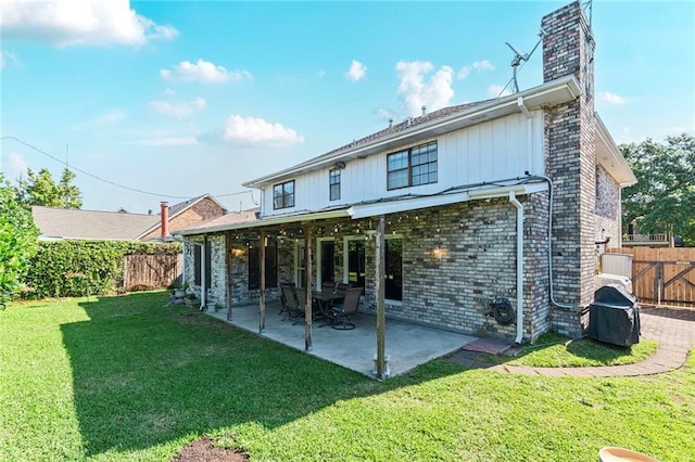 3528 Tolmas Dr, Metairie, LA 70002 - back of house featuring a chimney, a fenced backyard, and a lawn