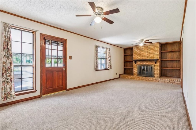 106 Somerset Rd, La Place, LA 70068 - unfurnished living room with a textured ceiling, ornamental molding, a ceiling fan, and plenty of natural light