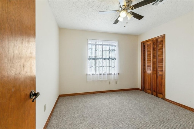 106 Somerset Rd, La Place, LA 70068 - unfurnished bedroom featuring carpet floors, a closet, visible vents, and a textured ceiling
