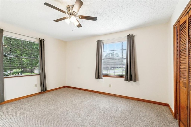 106 Somerset Rd, La Place, LA 70068 - unfurnished bedroom with a closet, baseboards, a ceiling fan, and carpet