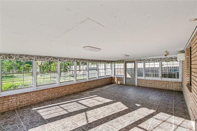 106 Somerset Rd, La Place, LA 70068 - unfurnished sunroom featuring a wealth of natural light and brick wall