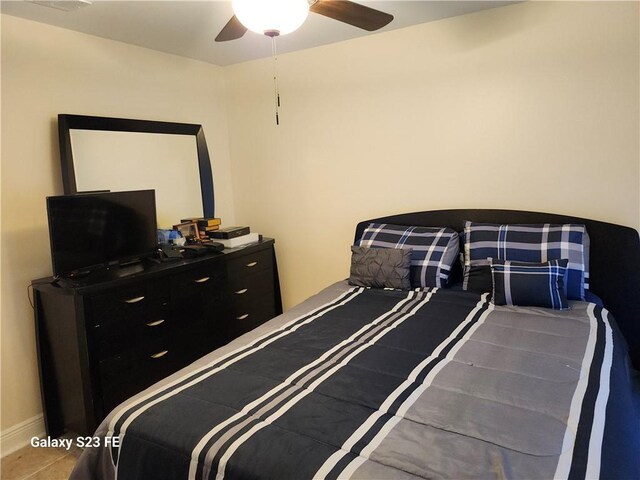637 Foxwood Ln, La Place, LA 70068 - bedroom featuring baseboards and ceiling fan