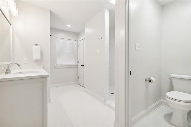 2605 Privateer Blvd, Barataria, LA 70036 - bathroom featuring toilet, vanity, baseboards, recessed lighting, and a shower