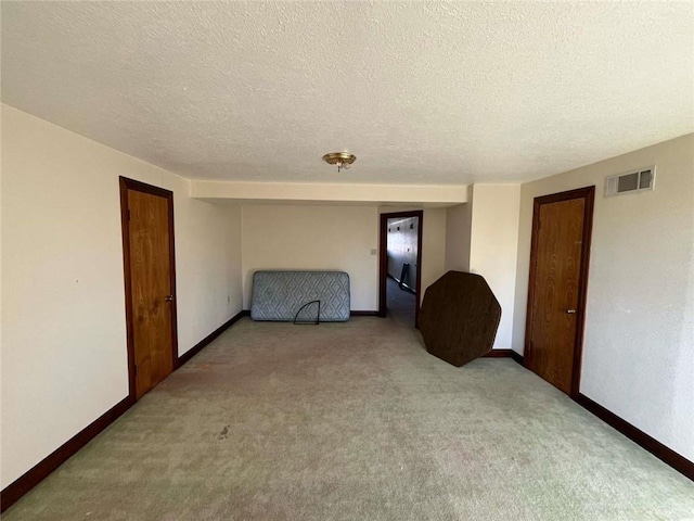 721 Central Ave, Reserve, LA 70084 - unfurnished room with light carpet, baseboards, visible vents, and a textured ceiling