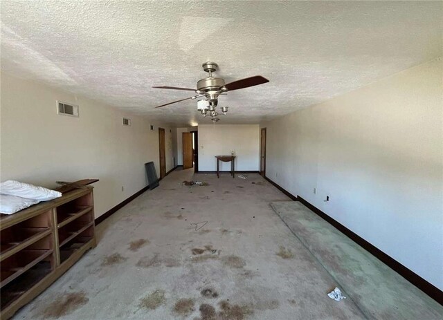 721 Central Ave, Reserve, LA 70084 - interior space featuring a textured ceiling, baseboards, a ceiling fan, and visible vents