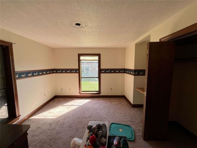 721 Central Ave, Reserve, LA 70084 - unfurnished bedroom featuring baseboards, carpet flooring, and a textured ceiling