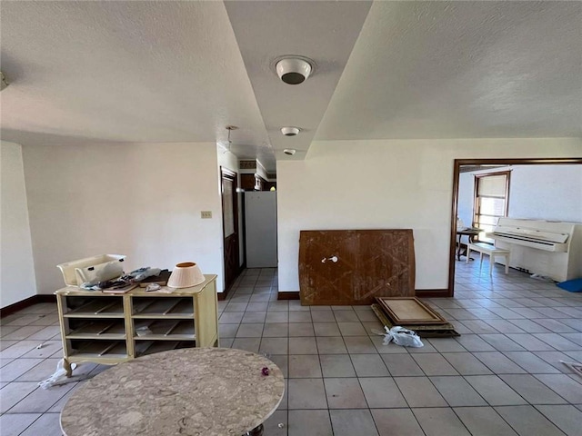 721 Central Ave, Reserve, LA 70084 - interior space with light tile patterned floors, a textured ceiling, and baseboards