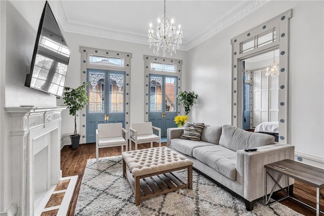 818 Bourbon St Unit 2A, New Orleans, LA 70116 - living room featuring a chandelier, crown molding, wood finished floors, and french doors