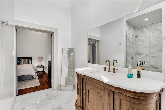 818 Bourbon St Unit 2A, New Orleans, LA 70116 - bathroom featuring a shower stall, vanity, marble look tiles, and connected bathroom
