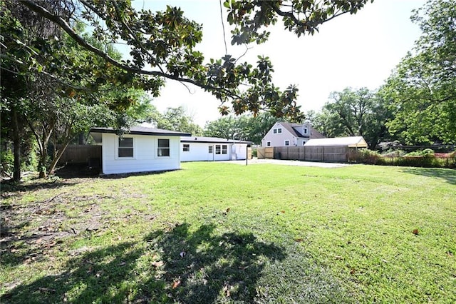 view of yard featuring a fenced backyard