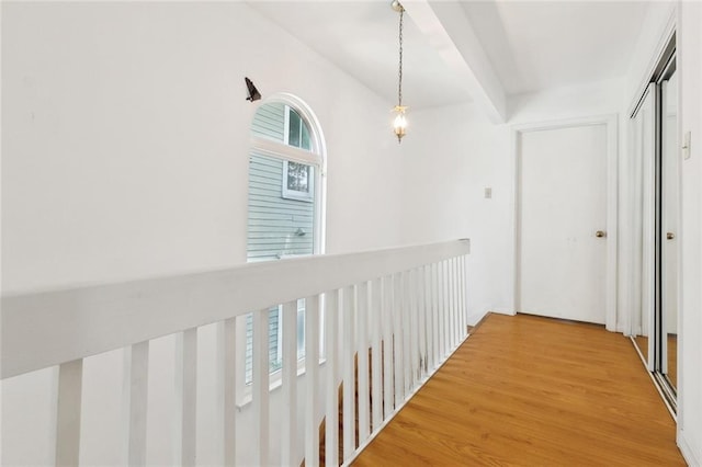 corridor featuring wood finished floors