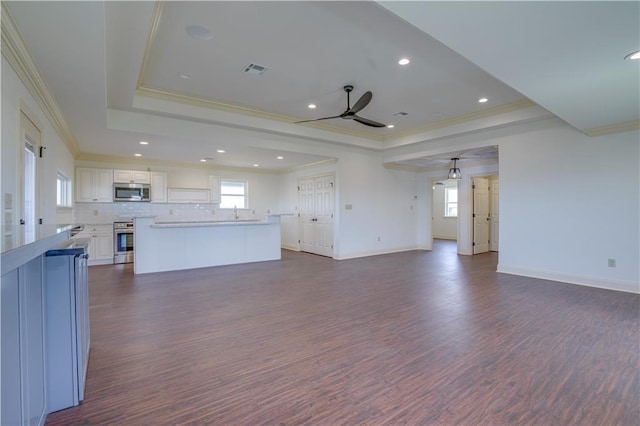 25759 Chef Menteur Hwy, New Orleans, LA 70129 - unfurnished living room with a tray ceiling, a ceiling fan, ornamental molding, and visible vents