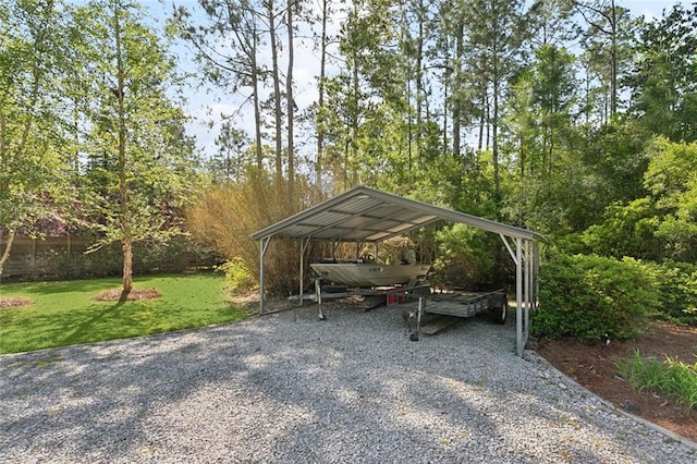 60209 Pine Dr, Lacombe, LA 70445 - view of parking / parking lot featuring a carport and driveway