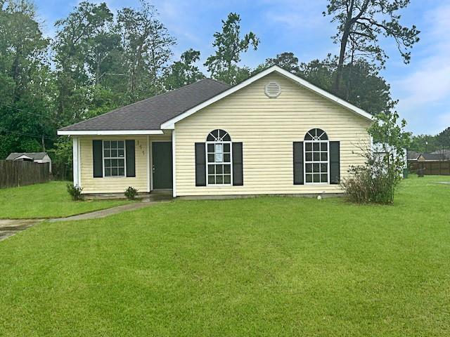 ranch-style house with a front lawn
