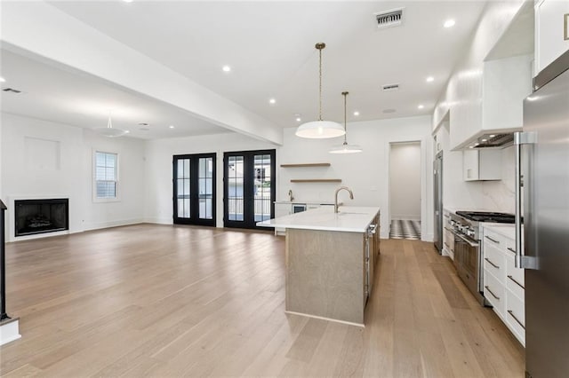 6371 Louis Xiv St, New Orleans, LA 70124 - kitchen with high quality appliances, light countertops, white cabinetry, and recessed lighting