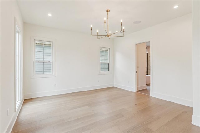 6371 Louis Xiv St, New Orleans, LA 70124 - empty room with a chandelier, light wood-style floors, healthy amount of natural light, and recessed lighting