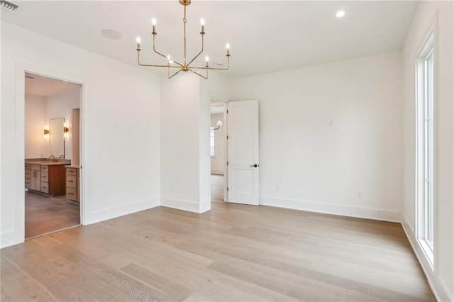 6371 Louis Xiv St, New Orleans, LA 70124 - spare room featuring a chandelier, light wood-style flooring, and recessed lighting